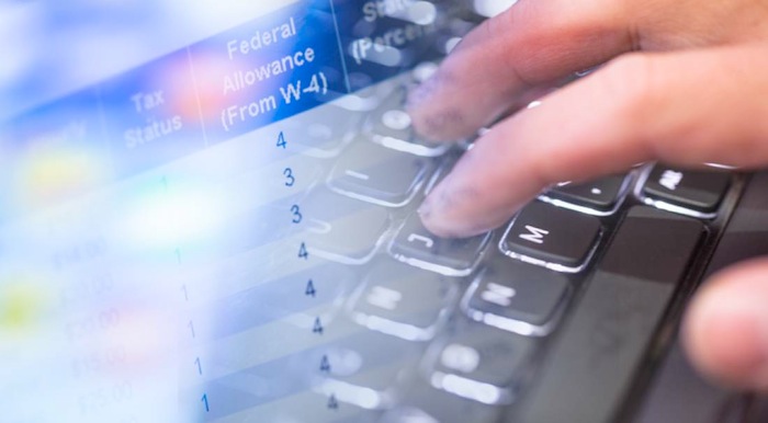 Person typing on a keyboard with table overlaid