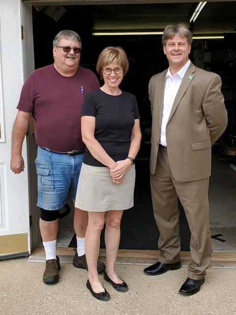 (L to R) Mike and Barbara Smith of Mini-Engine Repair, Inc. and Nelson Shaffer of Citizens National Bank